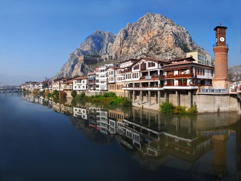 Riverfront Buildings and Mountain