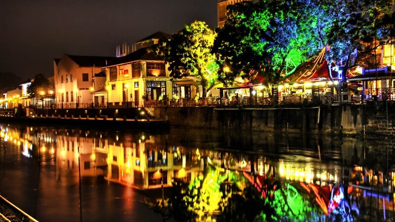 Riverfront Buildings at Night — Yellow, Calm, Photograph, Trees, Water, Green