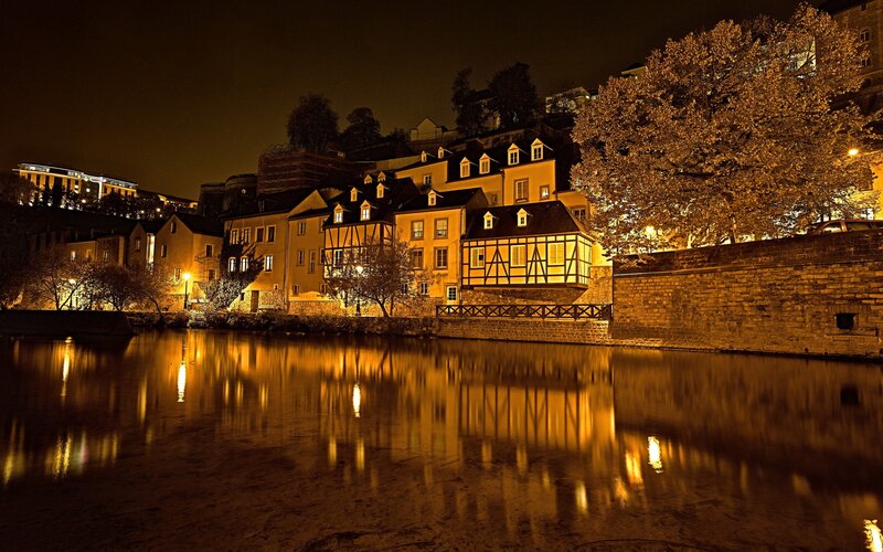 Riverfront Buildings at Night — Yellow, Serene, Photograph, River
