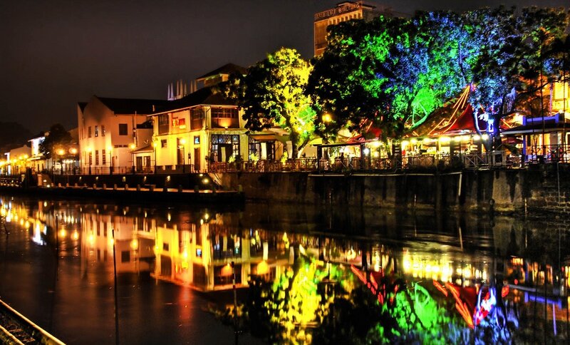 Riverfront Buildings at Night — Yellow