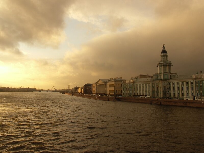 riverfront cityscape at sunset