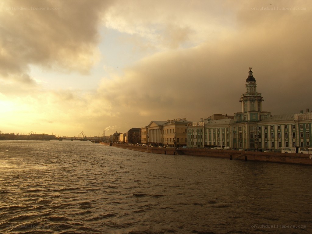 riverfront cityscape at sunset