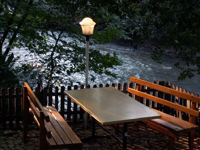 Riverfront seating area at dusk