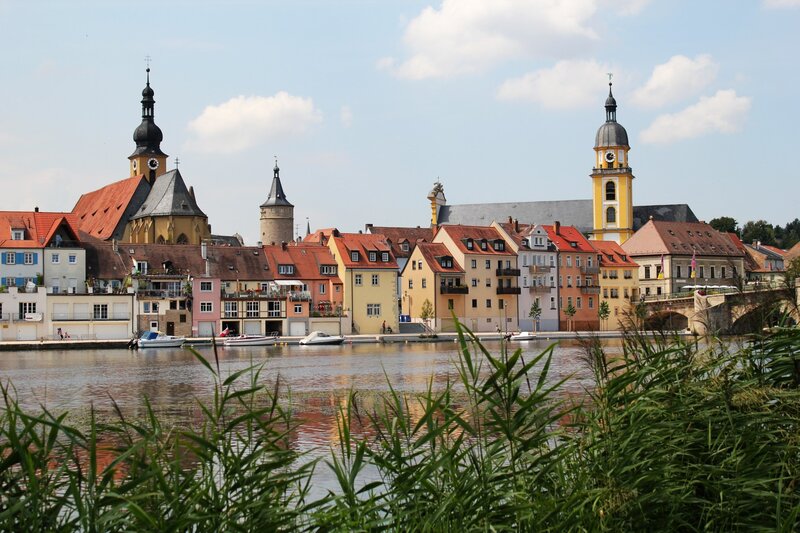 Riverfront town with church towers