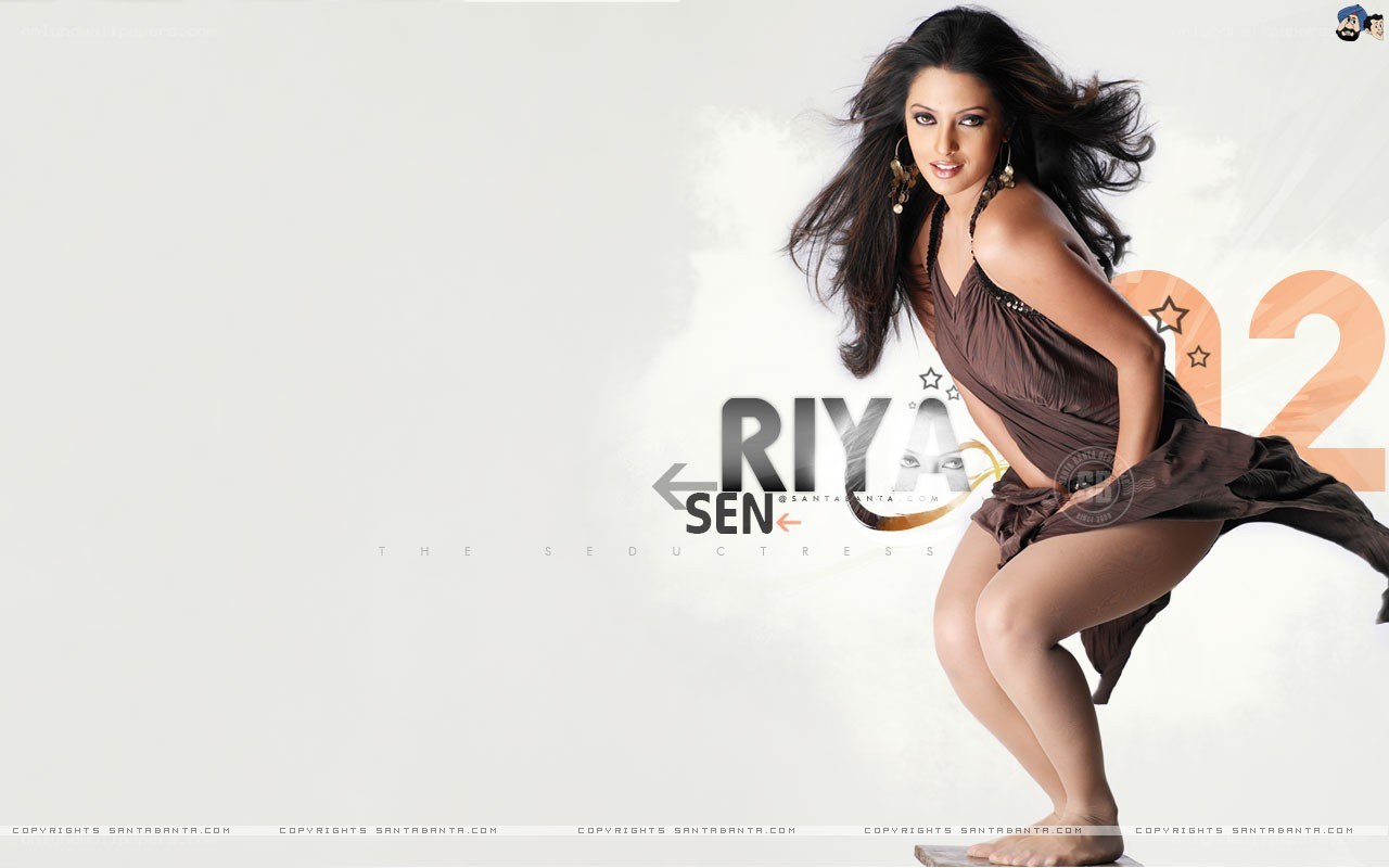 Riya Sen in a brown dress