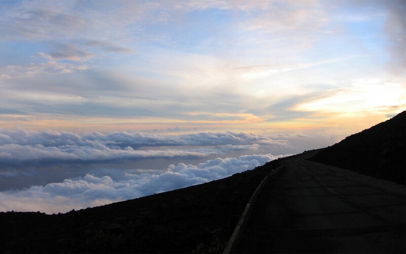 Road above the clouds at sunrise