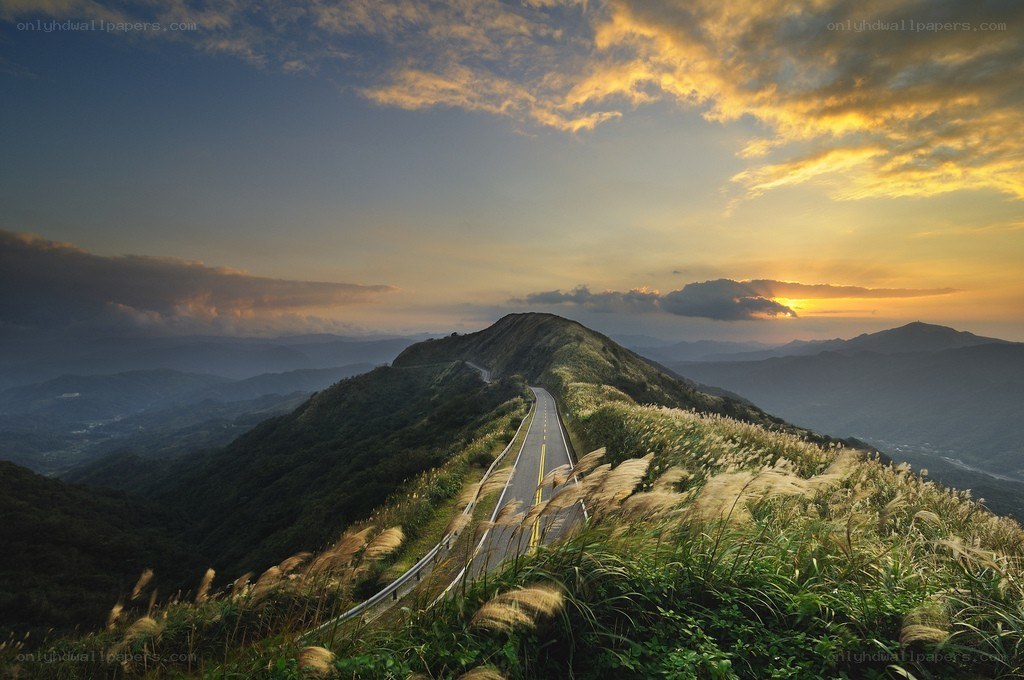 Road at sunset on a mountain ridge