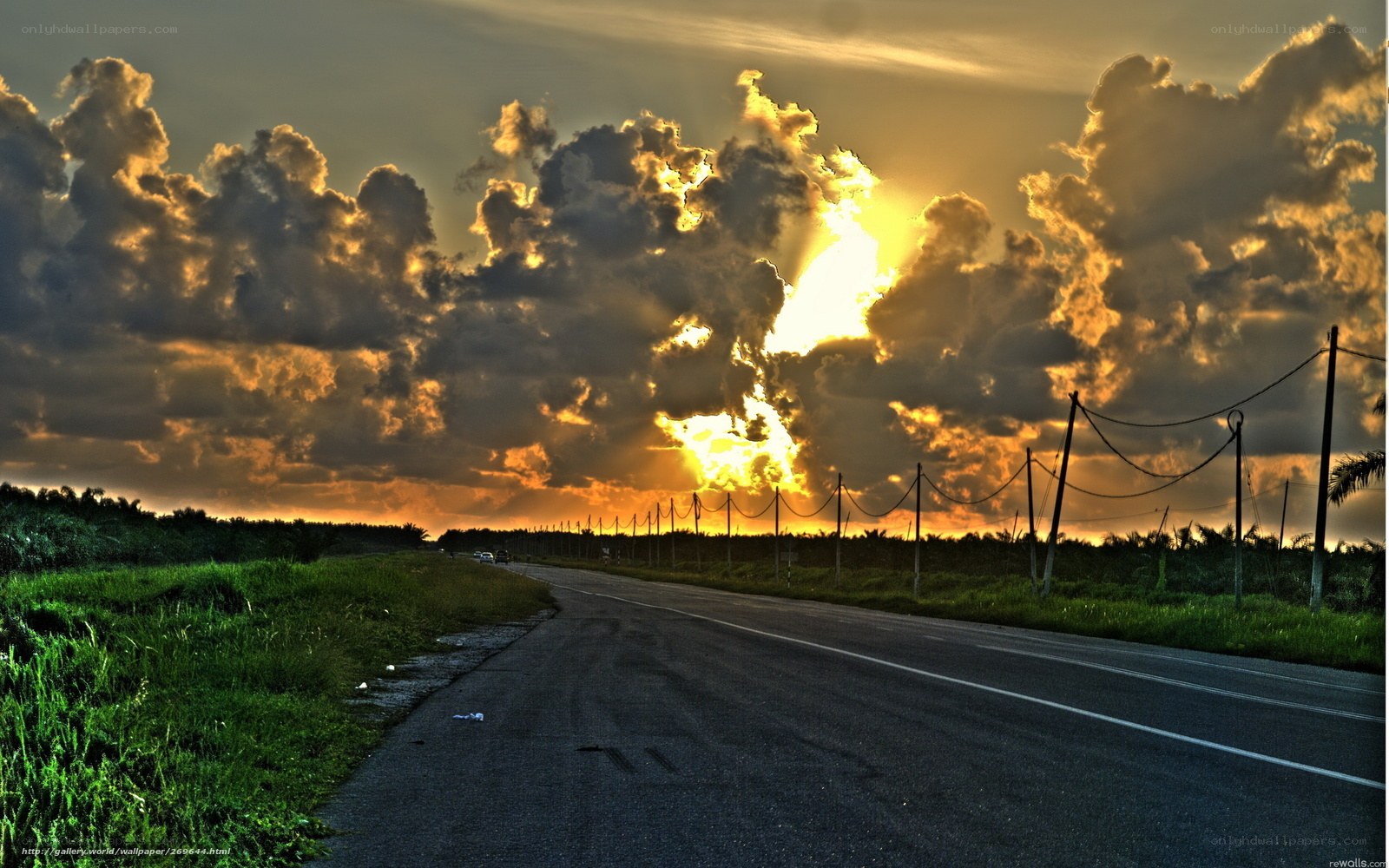 Road at sunset with dramatic clouds