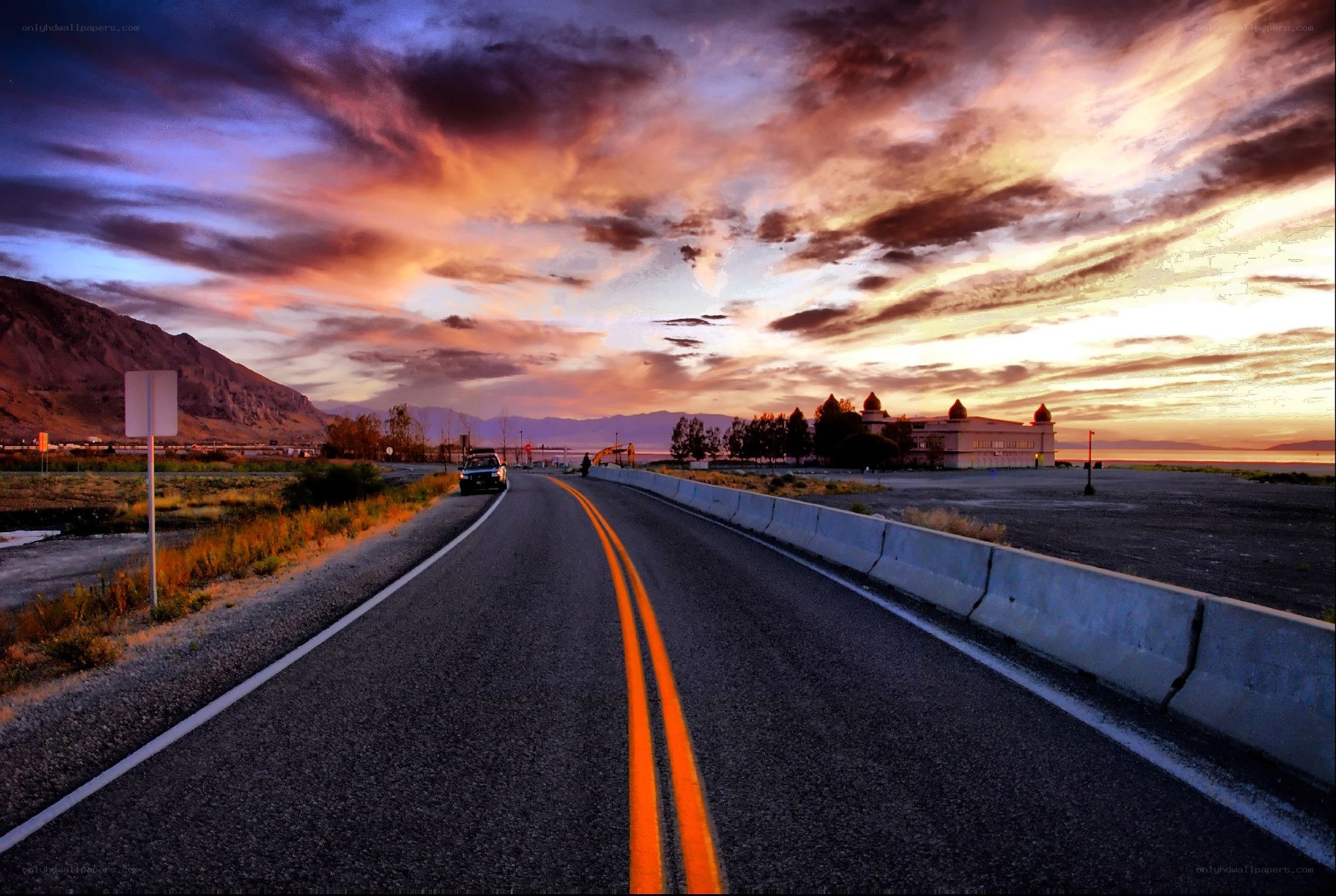 Road at sunset with dramatic sky