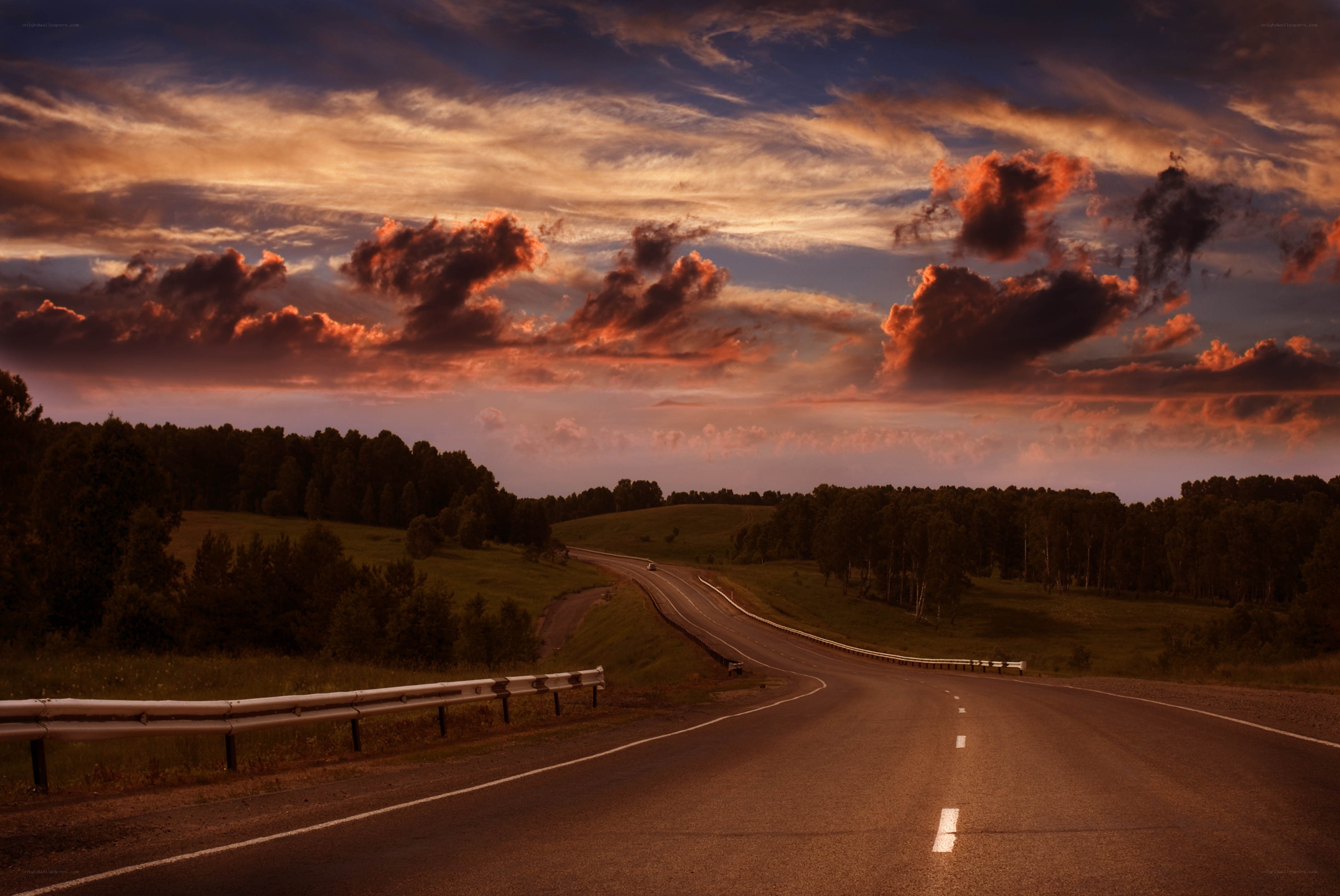 Road at sunset with dramatic sky