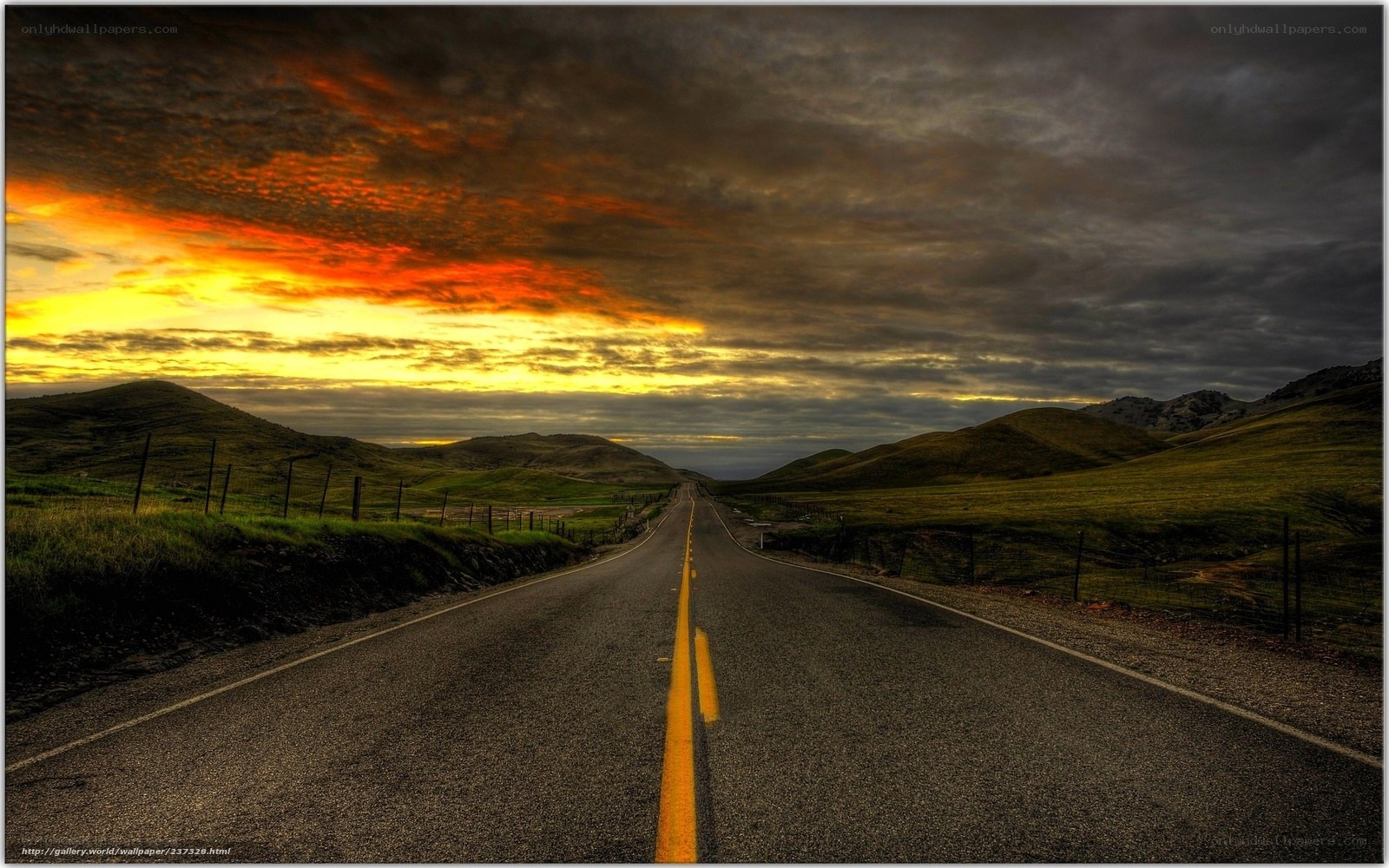 Road at sunset with hills