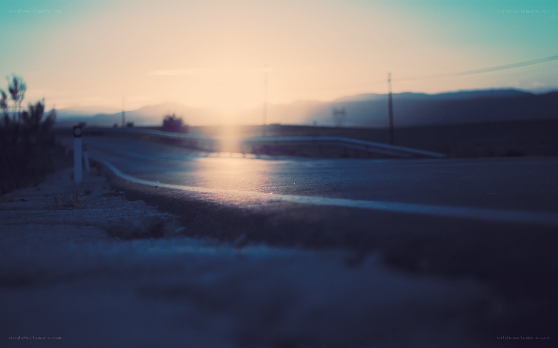 Road at sunset with mountains