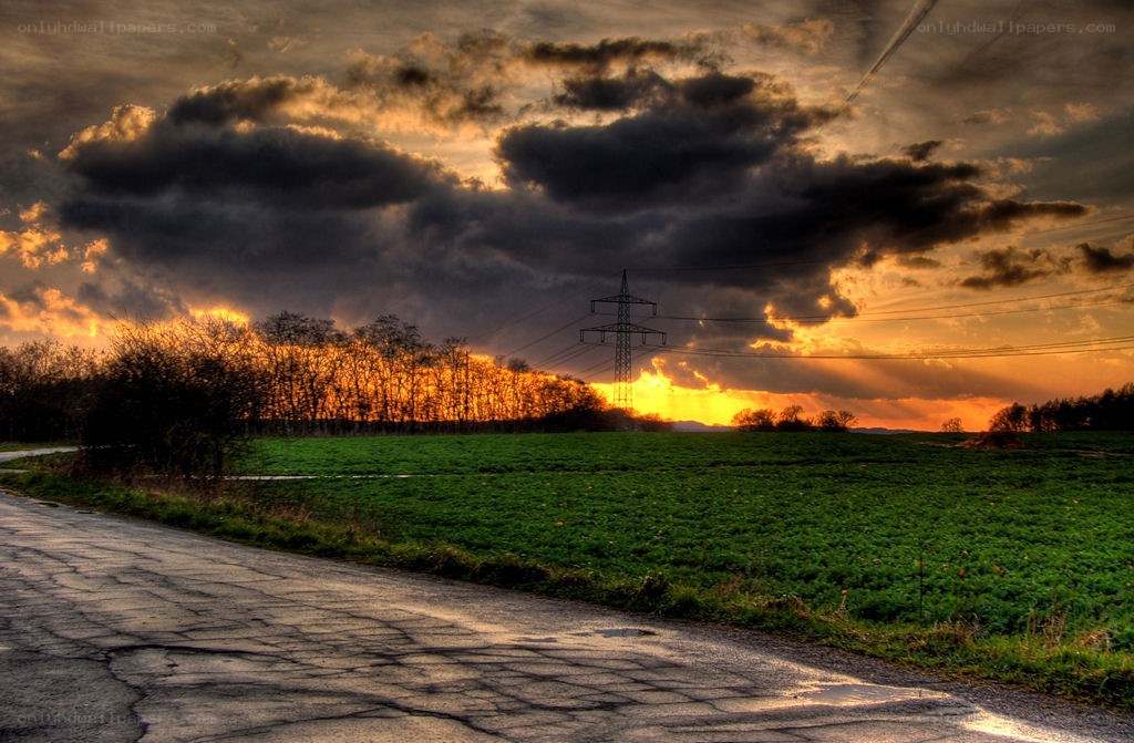 Road at sunset with power lines