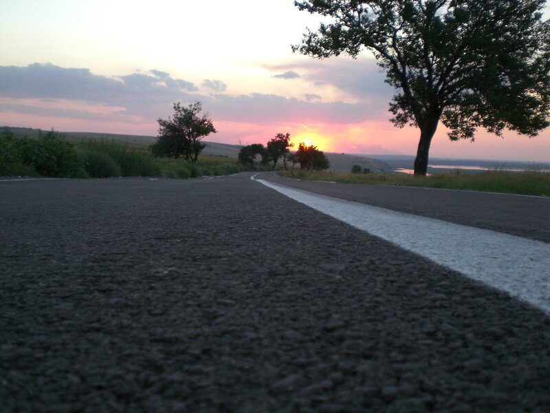 Road at sunset with river view