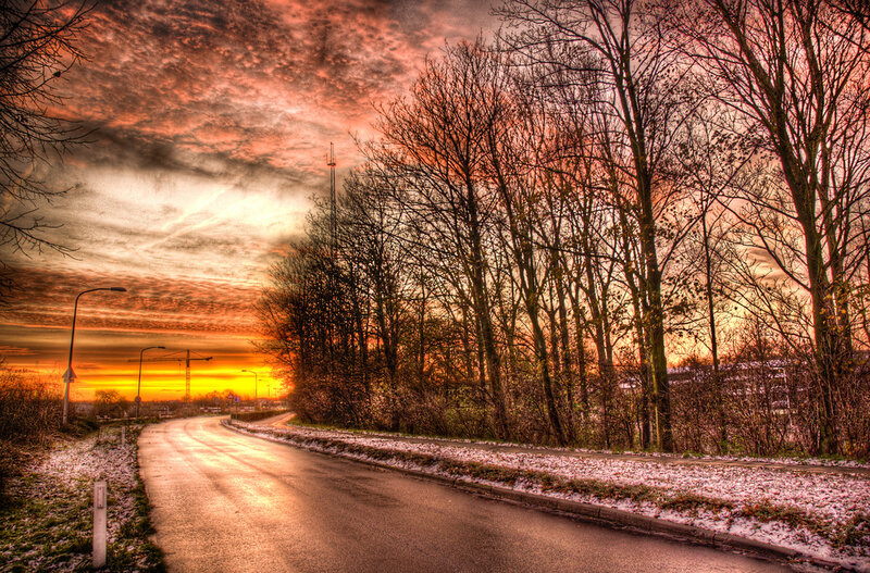 Road at sunset with snow