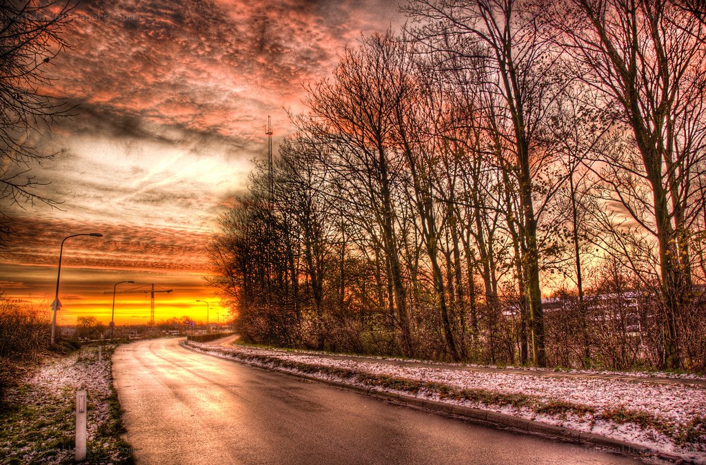 Road at sunset with snow