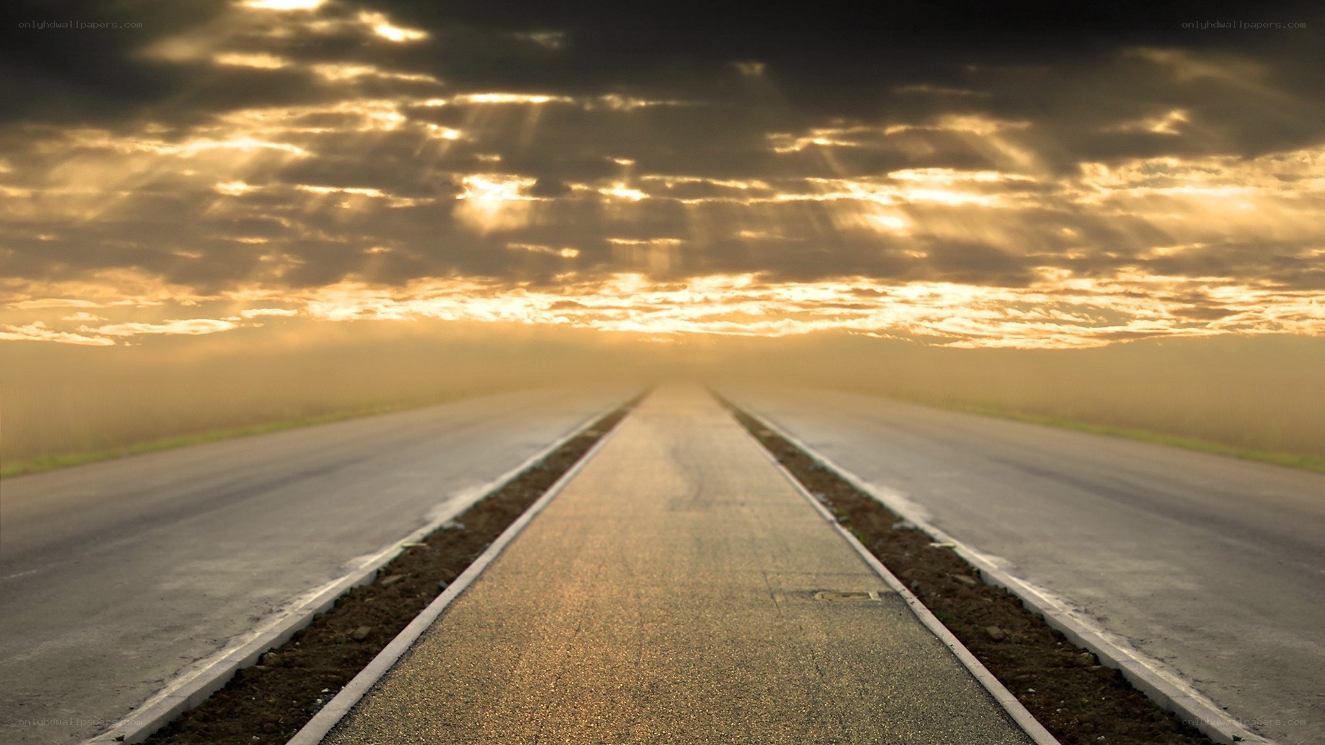 Road at sunset with sunbeams