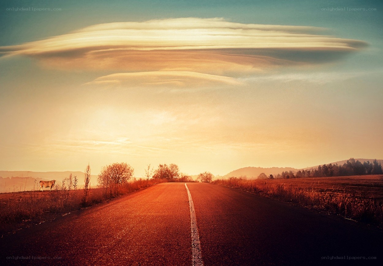 Road at sunset with unique clouds