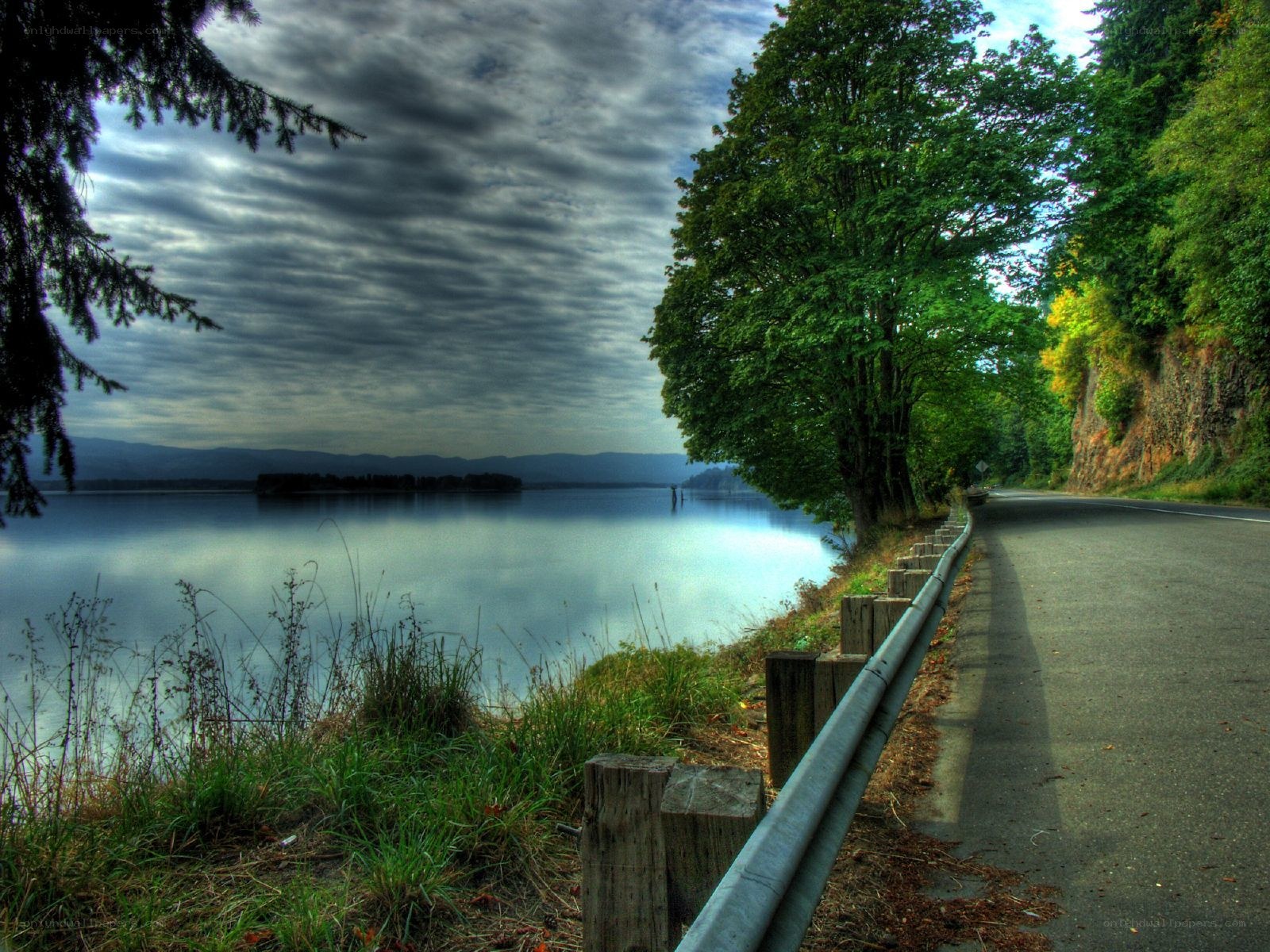 Road beside a calm lake
