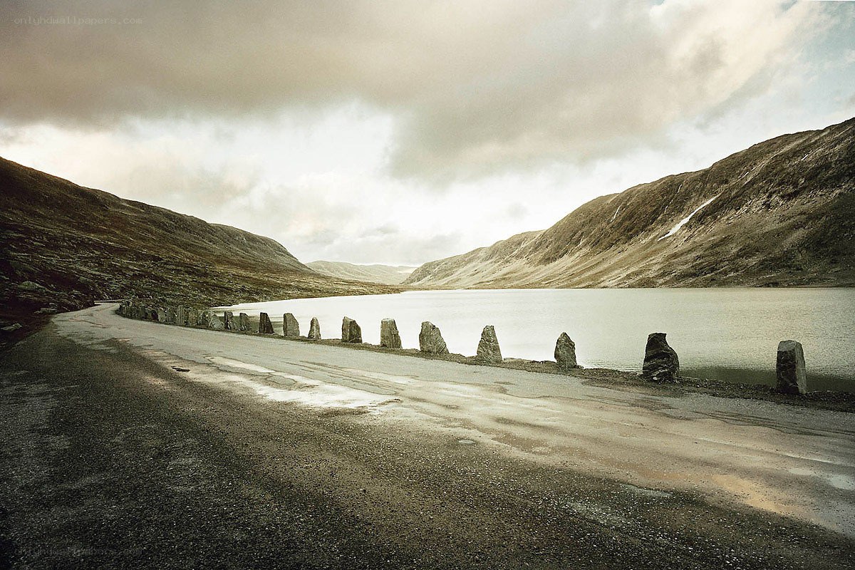Road beside a mountain lake