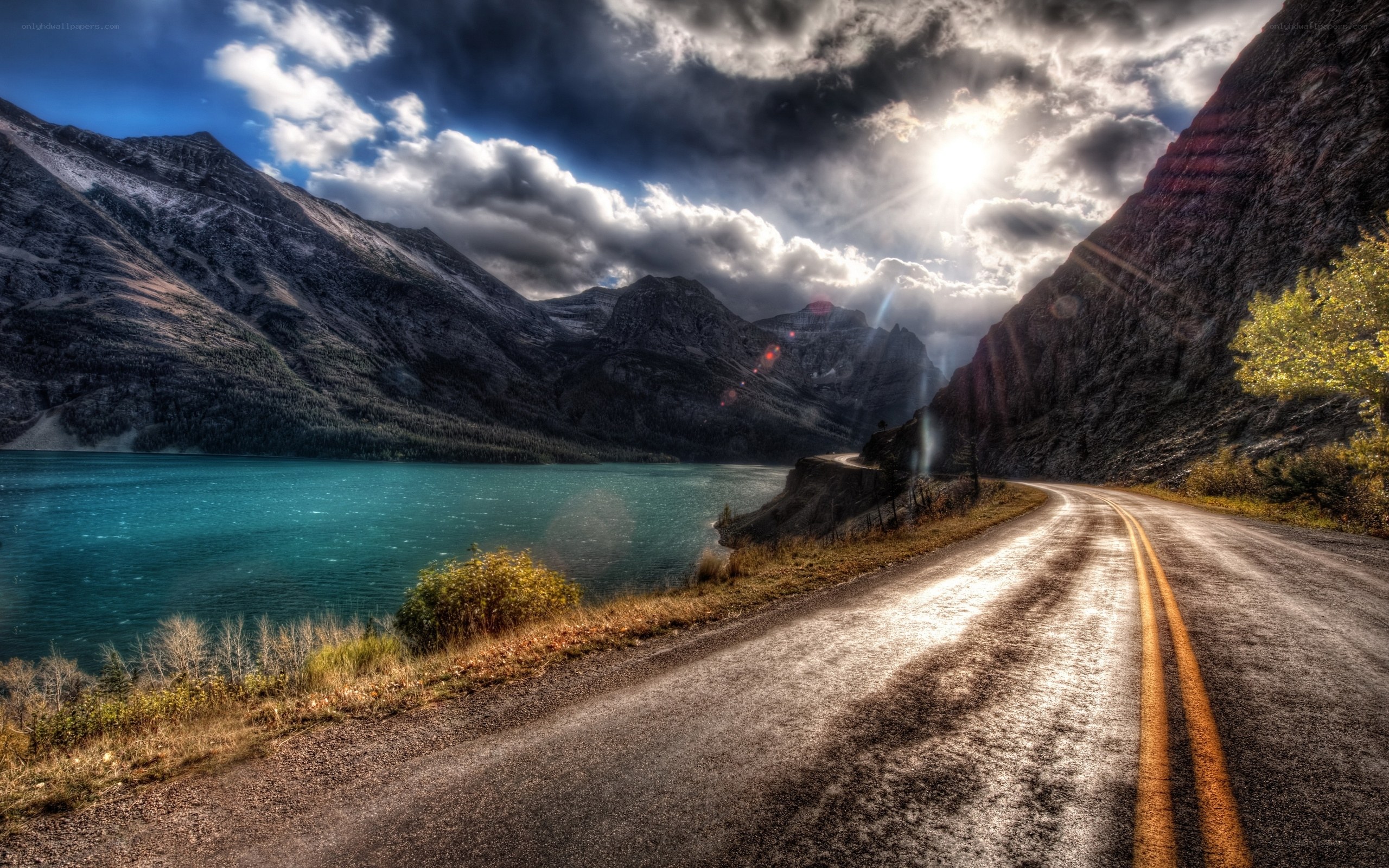 Road beside a mountain lake
