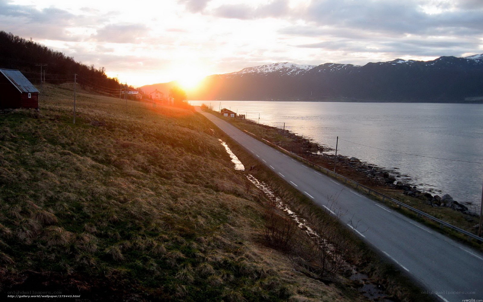 Road by the fjord at sunset