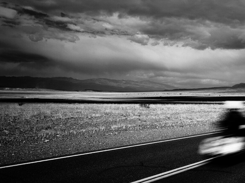 Road in the desert under stormy sky