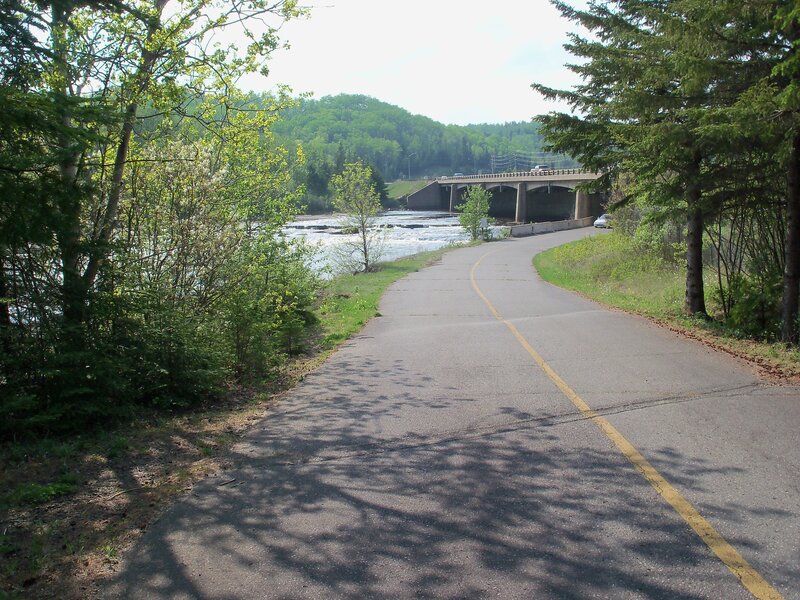 Road leading to a river bridge