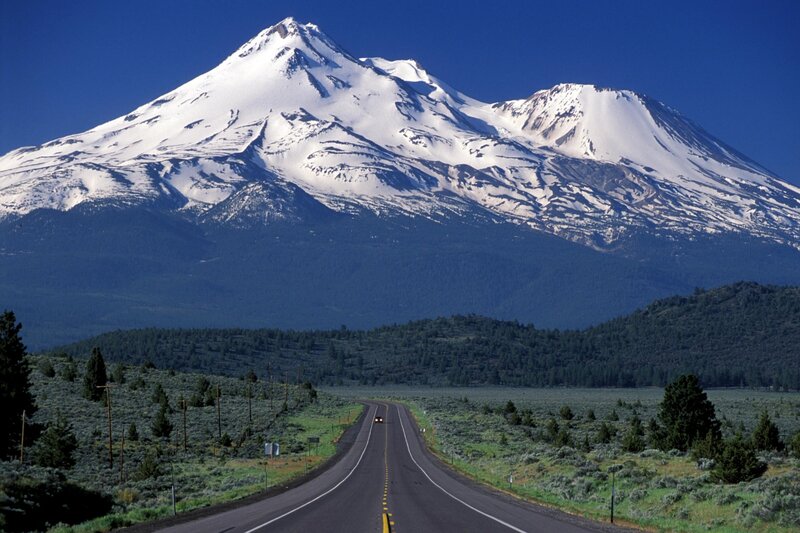 Road leading to a snow-capped mountain