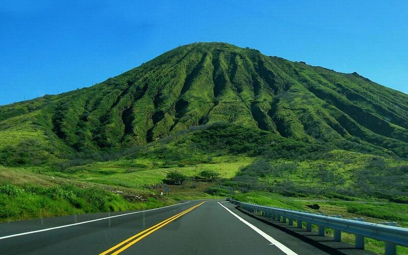 Road leading to green mountain
