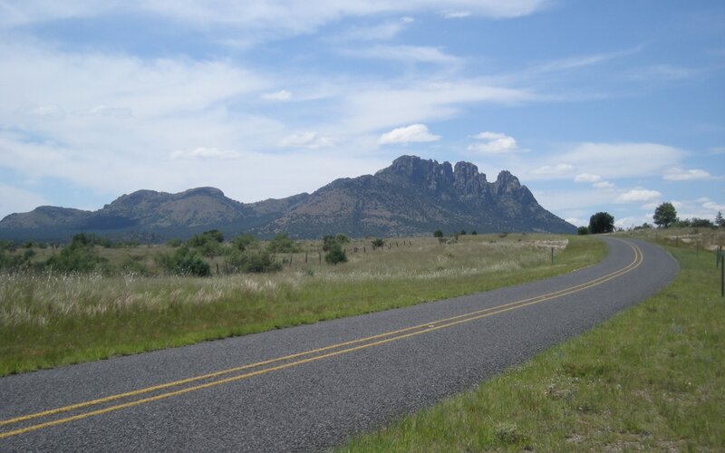 Road leading to rocky mountains