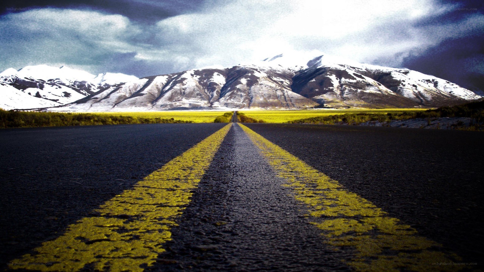 Road leading to snowy mountains