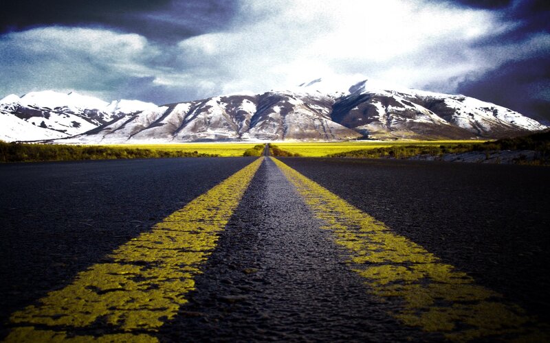 Road leading to snowy mountains