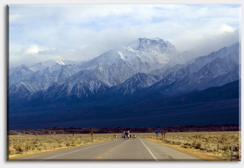 Road leading to snowy mountains