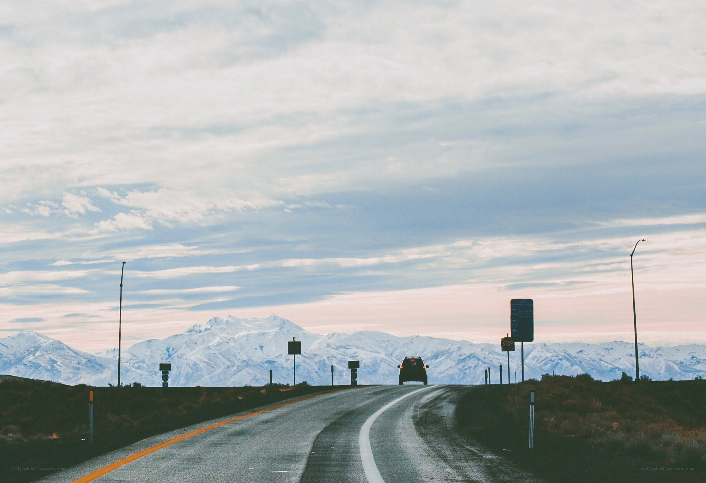 Road leading to snowy mountains