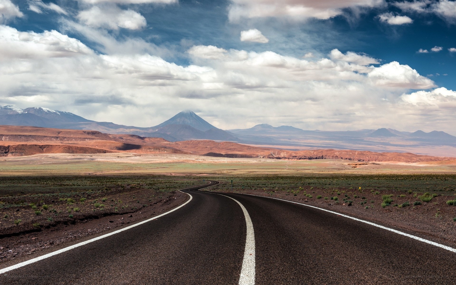 Road leading to volcanic mountains