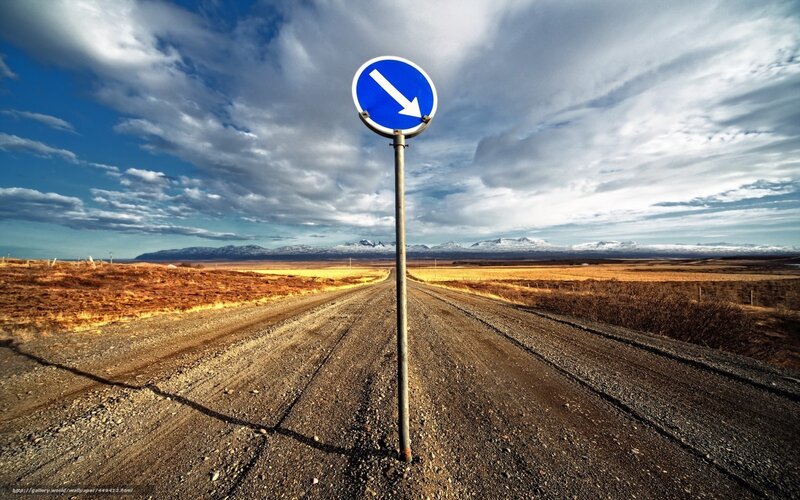 Road sign on a gravel path
