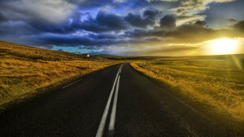 Road Stretching to Horizon — Blue, Dramatic, Sunset, Photograph, Clouds, Sun, House, Hills, Yellow