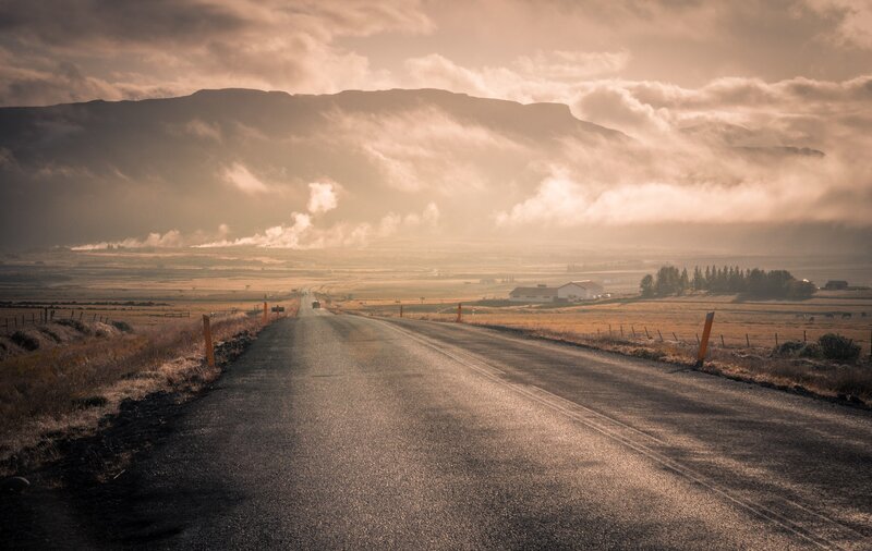 Road Stretching to Mountains — Brown