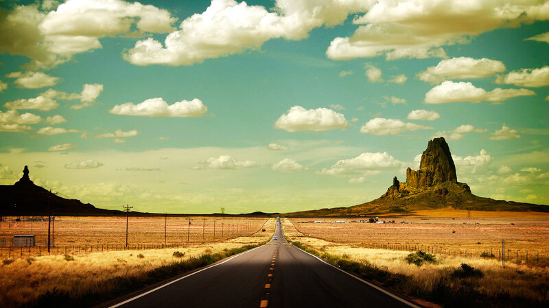 Road Stretching to Rock Formation