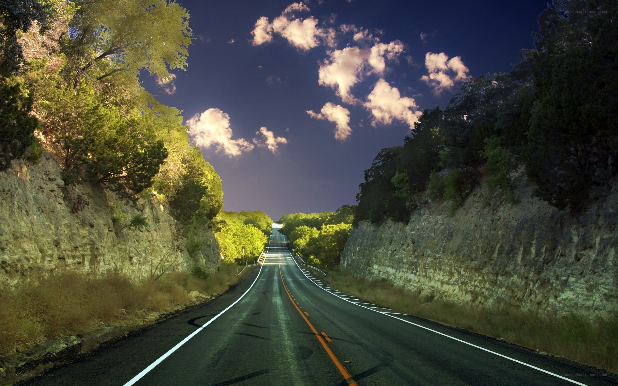 Road through a canyon at dusk