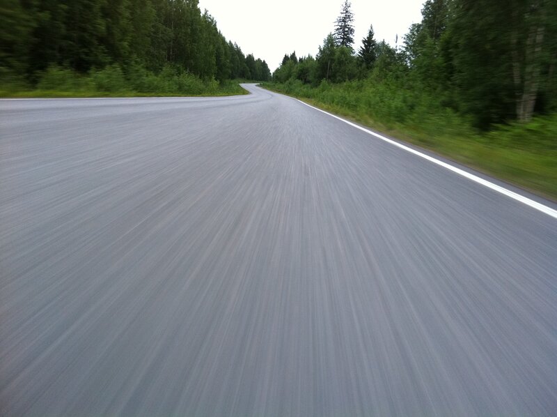 Road through forest at speed