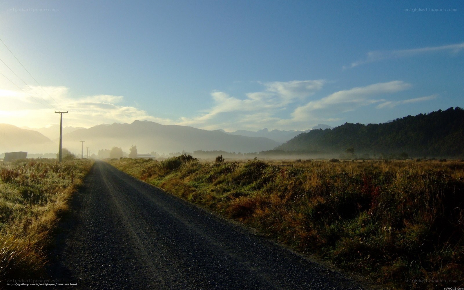 Road through misty valley