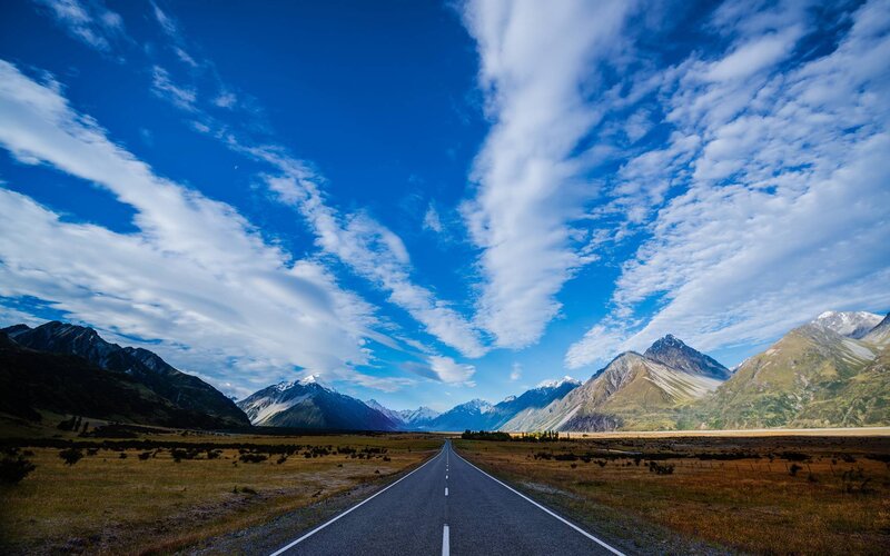 Road Through Mountain Valley — Blue, Serene, Afternoon, Photograph, Mountains, Sky