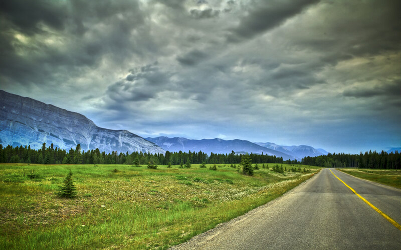 Road Through Mountain Valley — Green, Dramatic, Afternoon, Photograph, Mountains, Forest