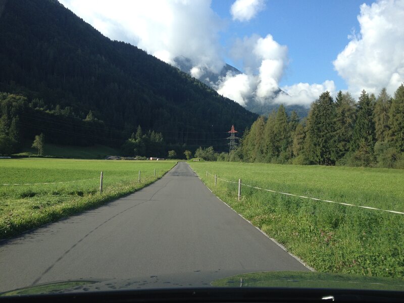Road Through Mountain Valley — Green, Serene, Afternoon, Photograph, Field