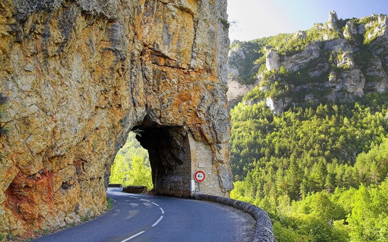Road Through Rock Tunnel — Green, Serene, Afternoon, Photograph, Mountain