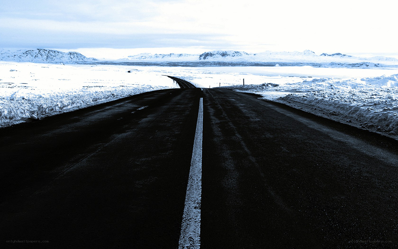 Road through snowy landscape
