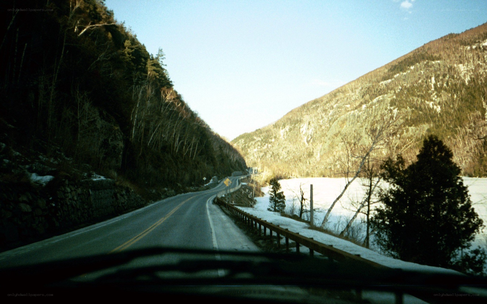 road through snowy mountain valley