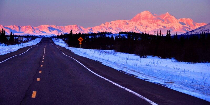 Road to a mountain at sunset